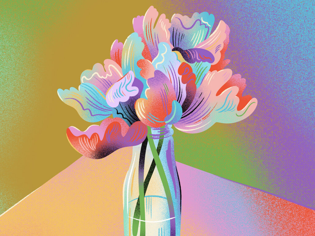 Un bouquet de tulipe de toutes les couleurs dans un vase.